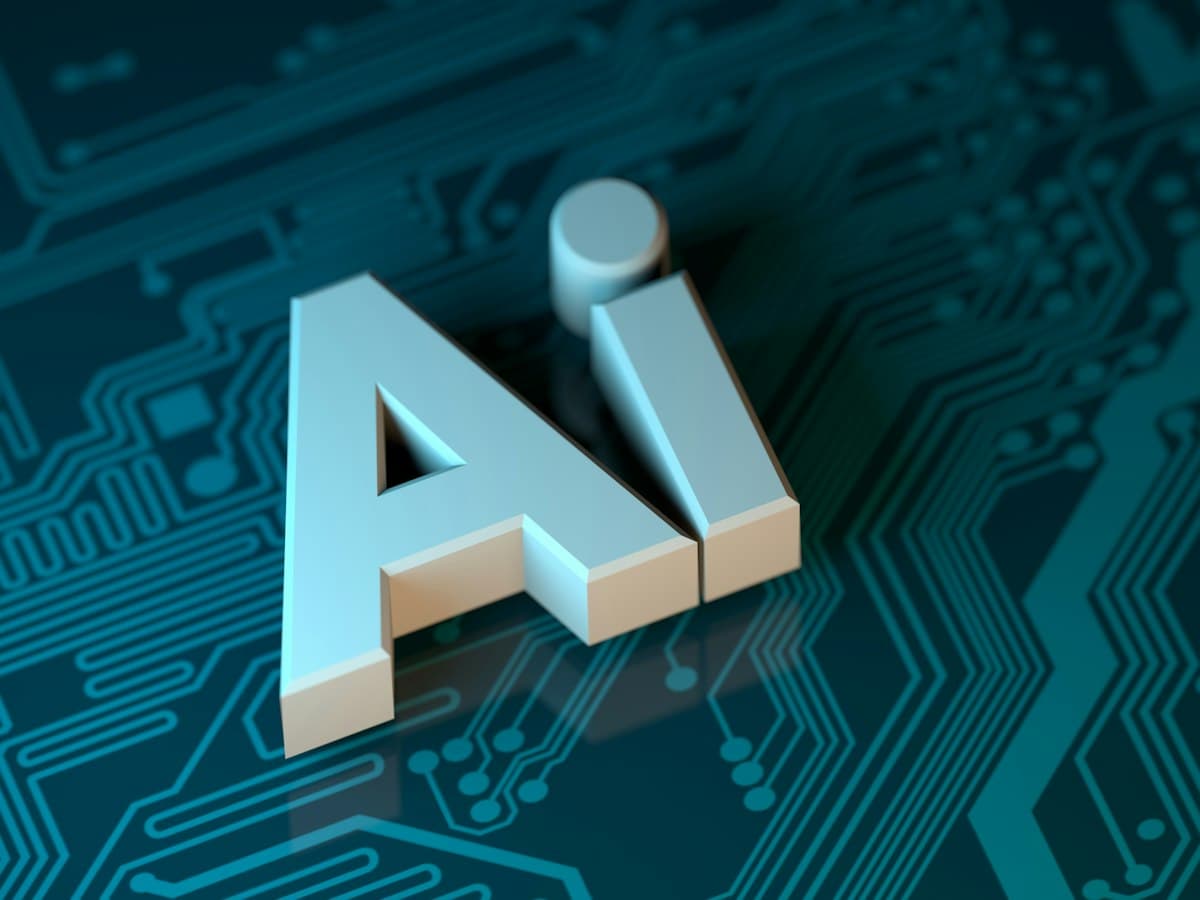 The letters AI standing on a glowing circuit board